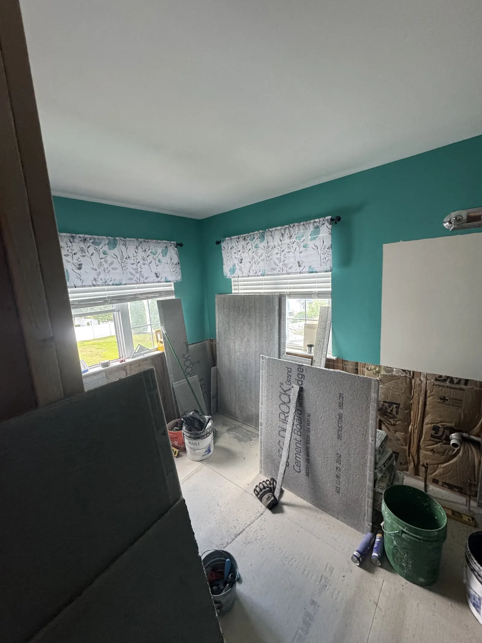 Room mid-renovation with new drywall going up